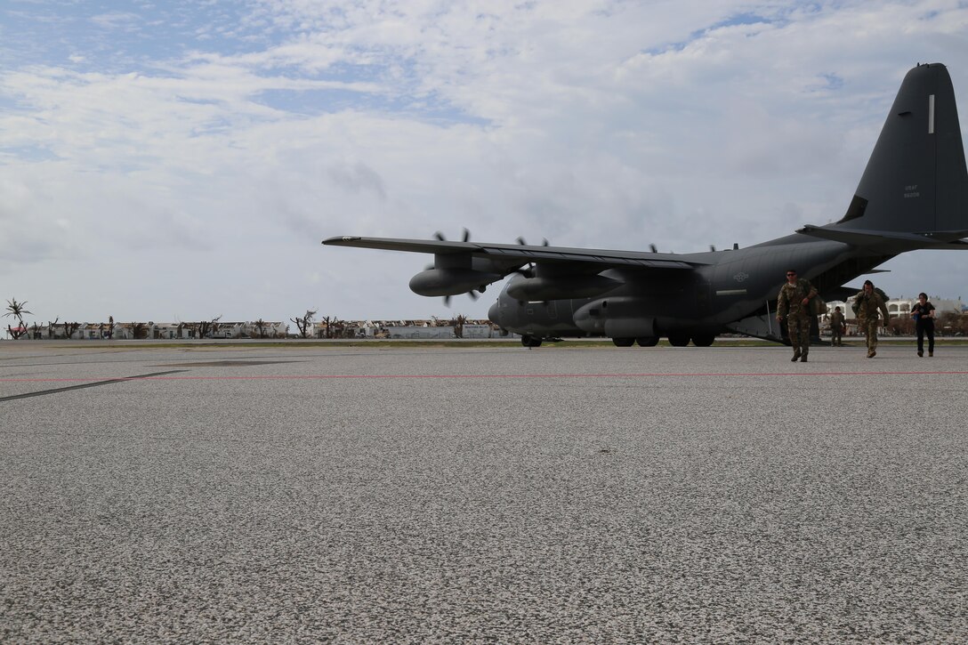 Hurricane relief personnel, including service members with Joint Task Force - Leeward Islands, disembark from a U.S. Air Force C-130 at Princess Juliana International Airport in Sint Maarten, Sept. 15, 2017.