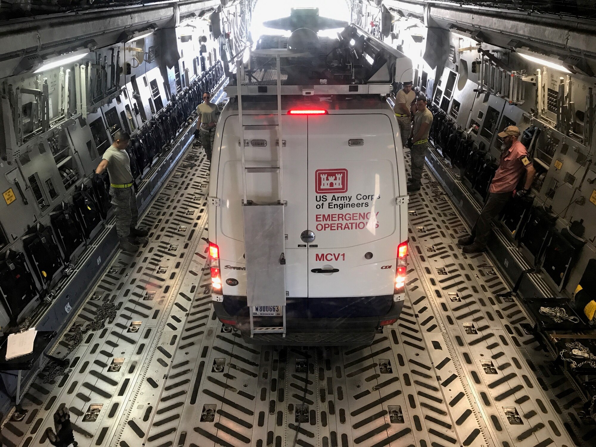 An Army Corps of Engineers emergency operations vehicle is loaded onto a C-17 Globemaster flown by the 732d Airlift Squadron, 514th Air Mobility Wing. The squadron has made multiple trips to hurricane affected areas delivering vehicles, supplies and personnel to assist with relief efforts.