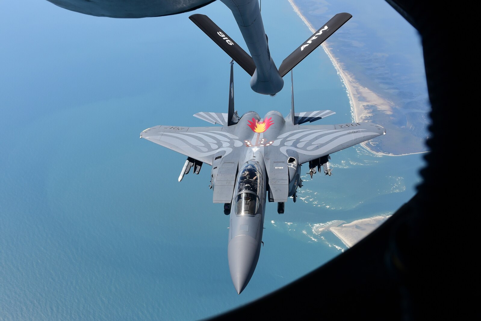 A 4th Fighter Wing F-15E Strike Eagle heritage paint scheme aircraft disconnects after refueling from a 916th Air Refueling Wing KC-135R Stratotanker, Sept. 14, 2017, in the skies above North Carolina.