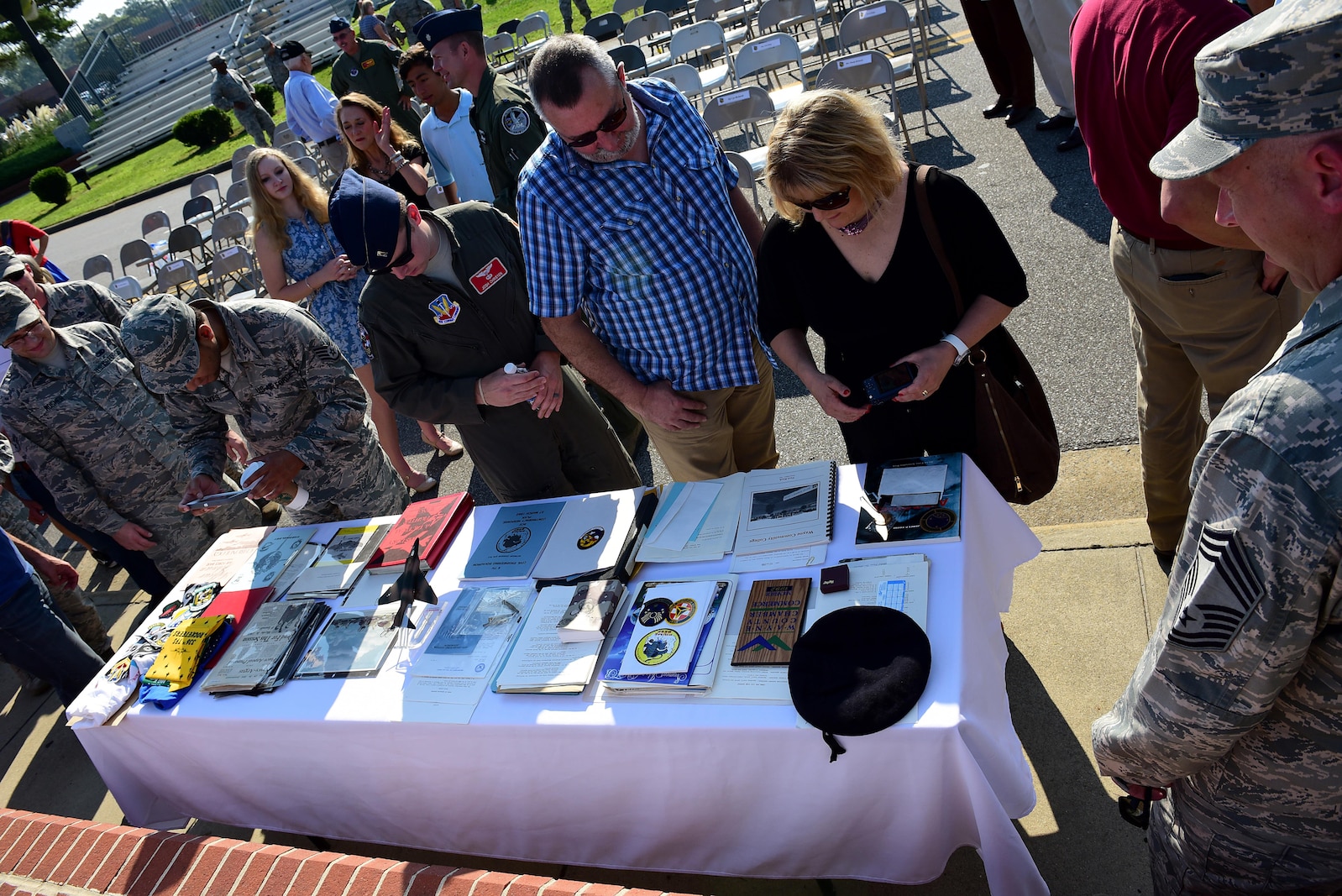 The audience and members from Team Seymour view the contents of the 1992 time capsule, Sept. 15, 2017, at Seymour Johnson Air Force Base, North Carolina. Some of the items included a copy of the local newspaper, 334th Fighter Squadron shirt, photos and a small F-4 Phantom II static. (U.S. Air Force photo by Airman 1st Class Kenneth Boyton)