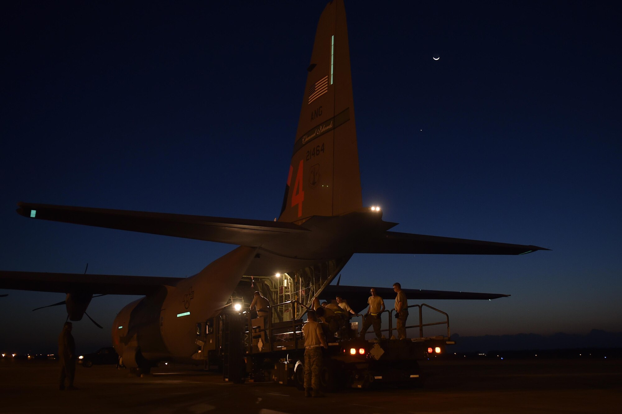 Aerial porters load cargo onto a C-130 Hercules aircraft at Homestead Air Reserve Base, Fla, Sep. 17, 2017.  The aircraft redeployed personnel and equipment from the Wisconsin National Guard back to their home station. The team had deployed to Florida in support of Hurricane Irma relief efforts. (U.S. Air Force photo by Tech. Sgt. Liliana Moreno/Released)