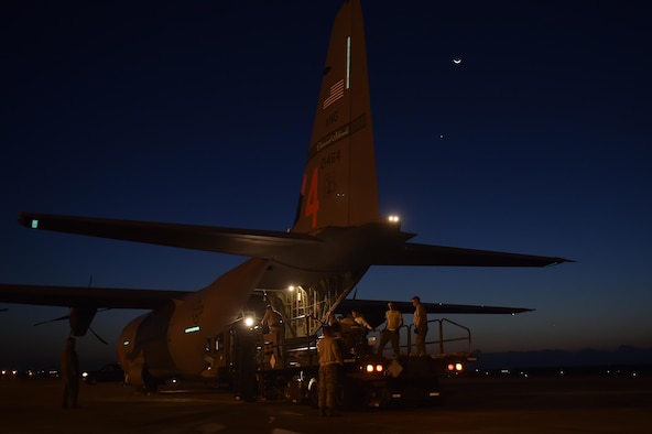 Aerial porters load cargo onto a C-130 Hercules aircraft at Homestead Air Reserve Base, Fla, Sep. 17, 2017.  The aircraft redeployed personnel and equipment from the Wisconsin National Guard back to their home station. The team had deployed to Florida in support of Hurricane Irma relief efforts. (U.S. Air Force photo by Tech. Sgt. Liliana Moreno/Released)