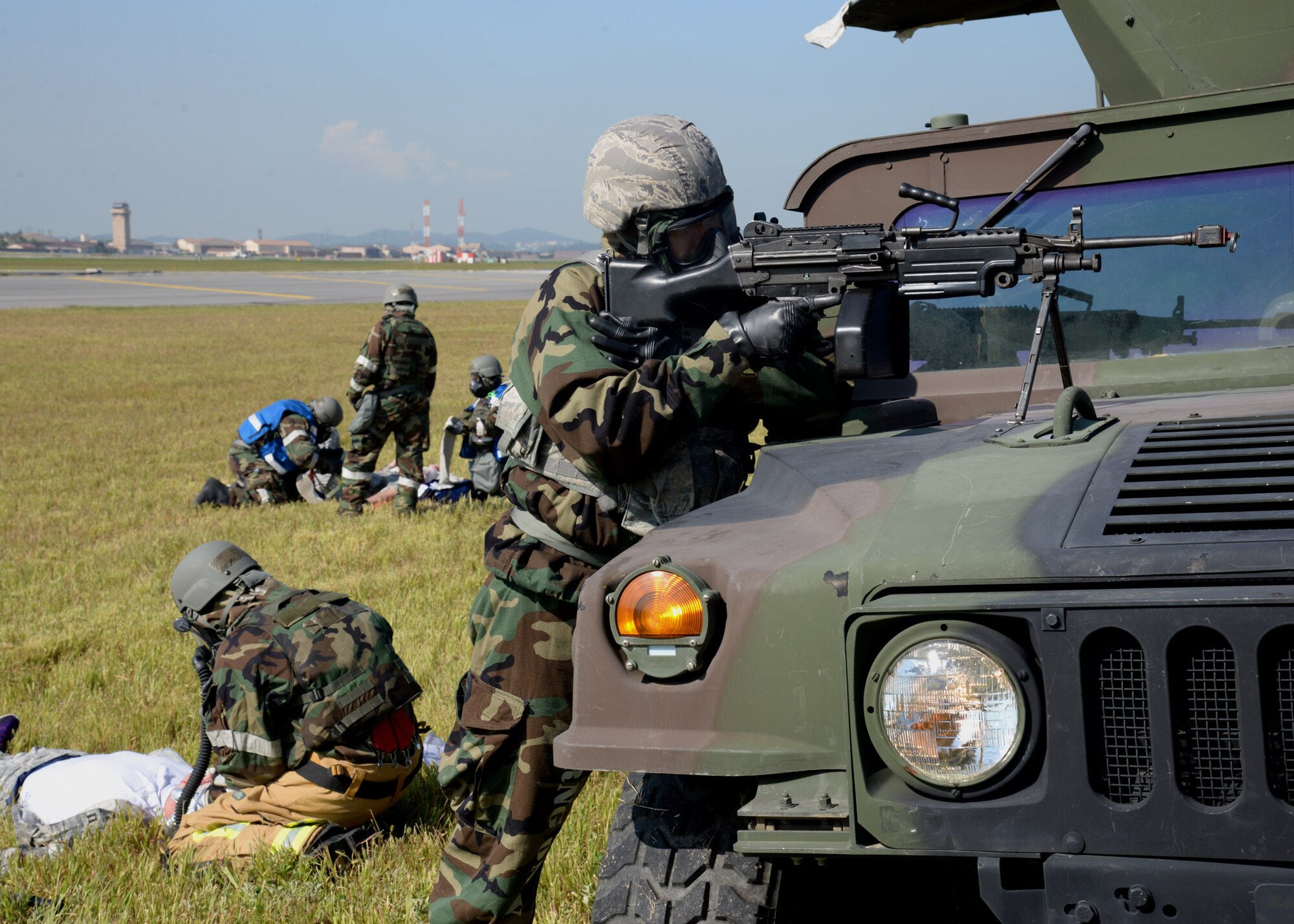 Airman 1st Class Gabriel Ruiz, far right, 51st Security Forces Squadron defender, secures the area of injured victims during a mass casualty scenario of exercise Beverly Herd 17-3 at Osan Air Base, Republic of Korea September 18, 2017. Following the explosion of a simulated theater ballistic missile, members of the First Response Team arrived on scene to defend and treat five casualties of the attack. (U.S. Air Force photo by Tech Sgt. Ashley Tyler/Released)
