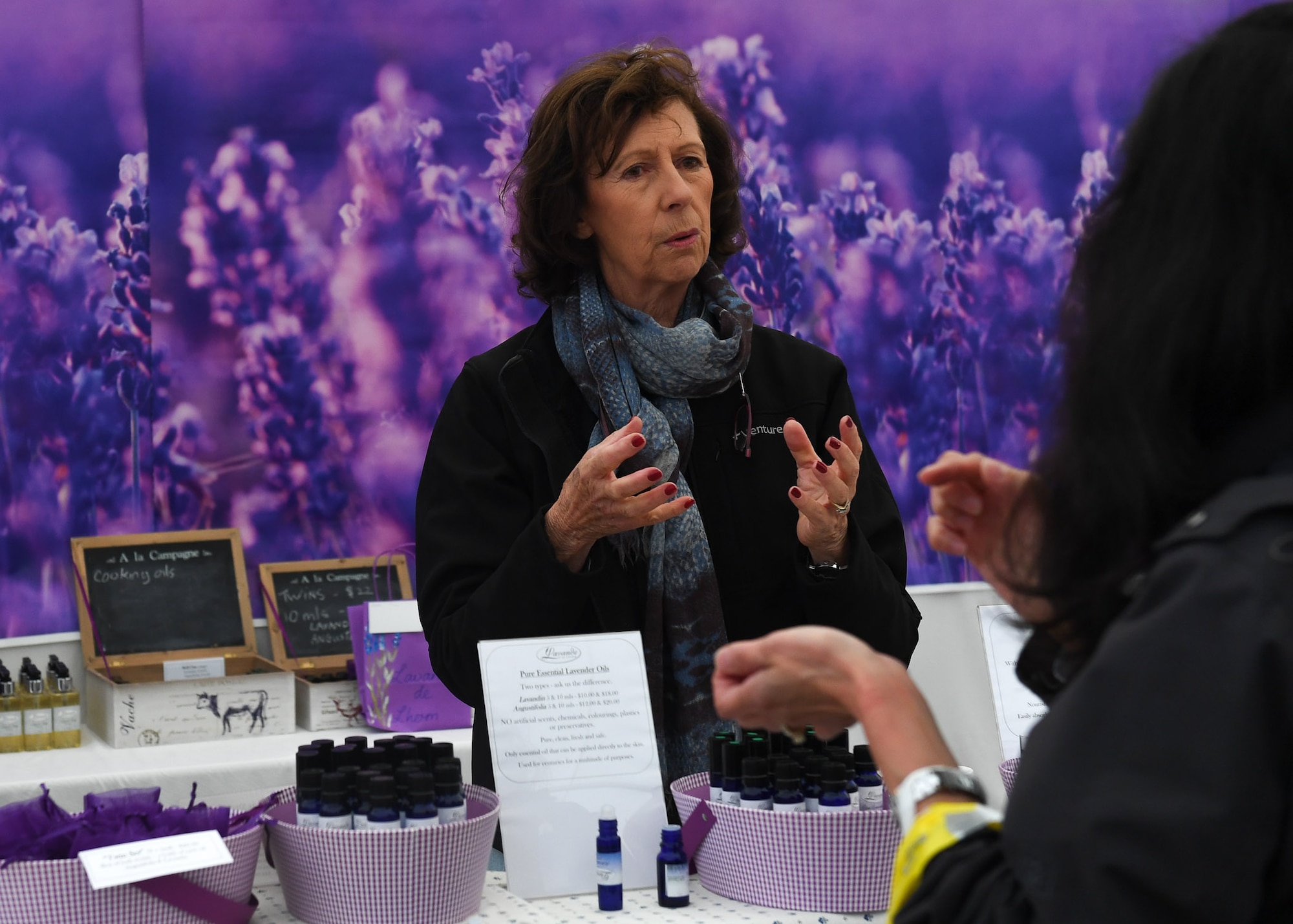Suzie Dick, 2017 Ramstein Bazaar vendor, speaks with a customer at the bazaar on Ramstein Air Base, Germany, Sept 14, 2017.