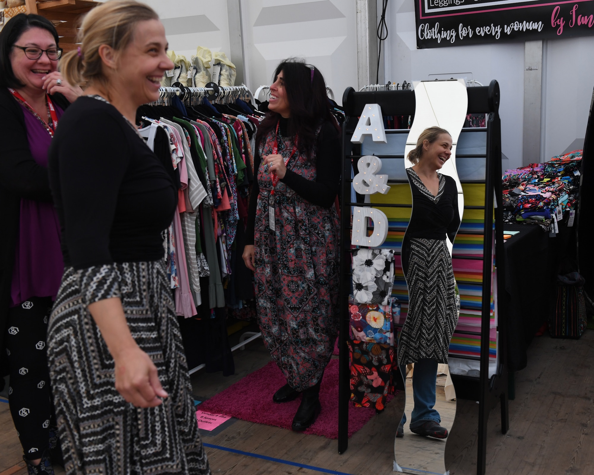 Deborah Herug, 2017 Ramstein Bazaar patron, tries on a dress at the bazaar on the Ramstein Air Base, Germany, Sept 15, 2017.