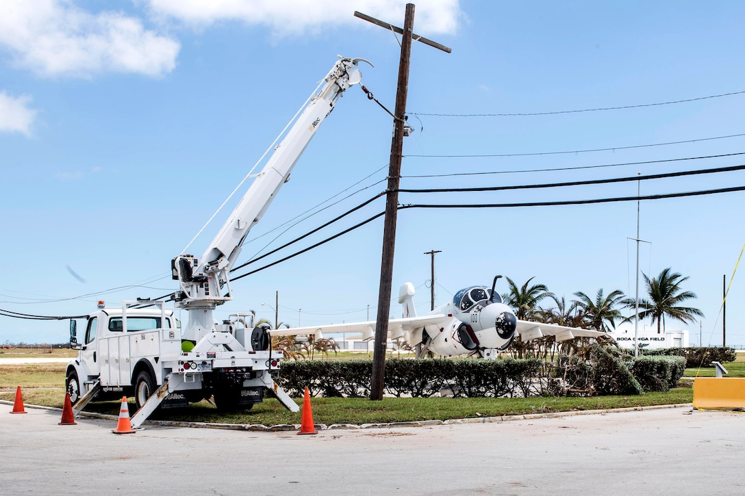 Contractors work on restoring power after the aftermath of Hurricane Irma.