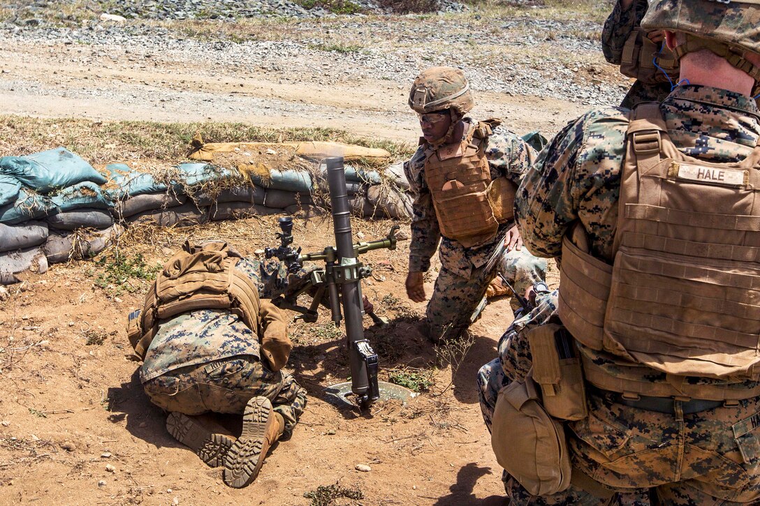 Marines fire a 60 mm mortar during an advanced infantry course.