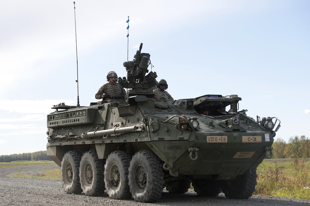 Soldiers maneuver their M1126 Stryker combat vehicle during live-fire training.