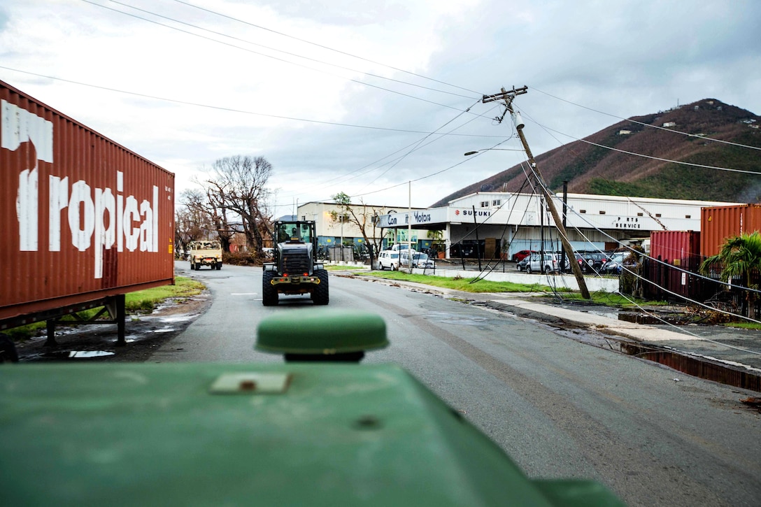 Marines travel to different communities within St. Thomas to clear debris from roadways.