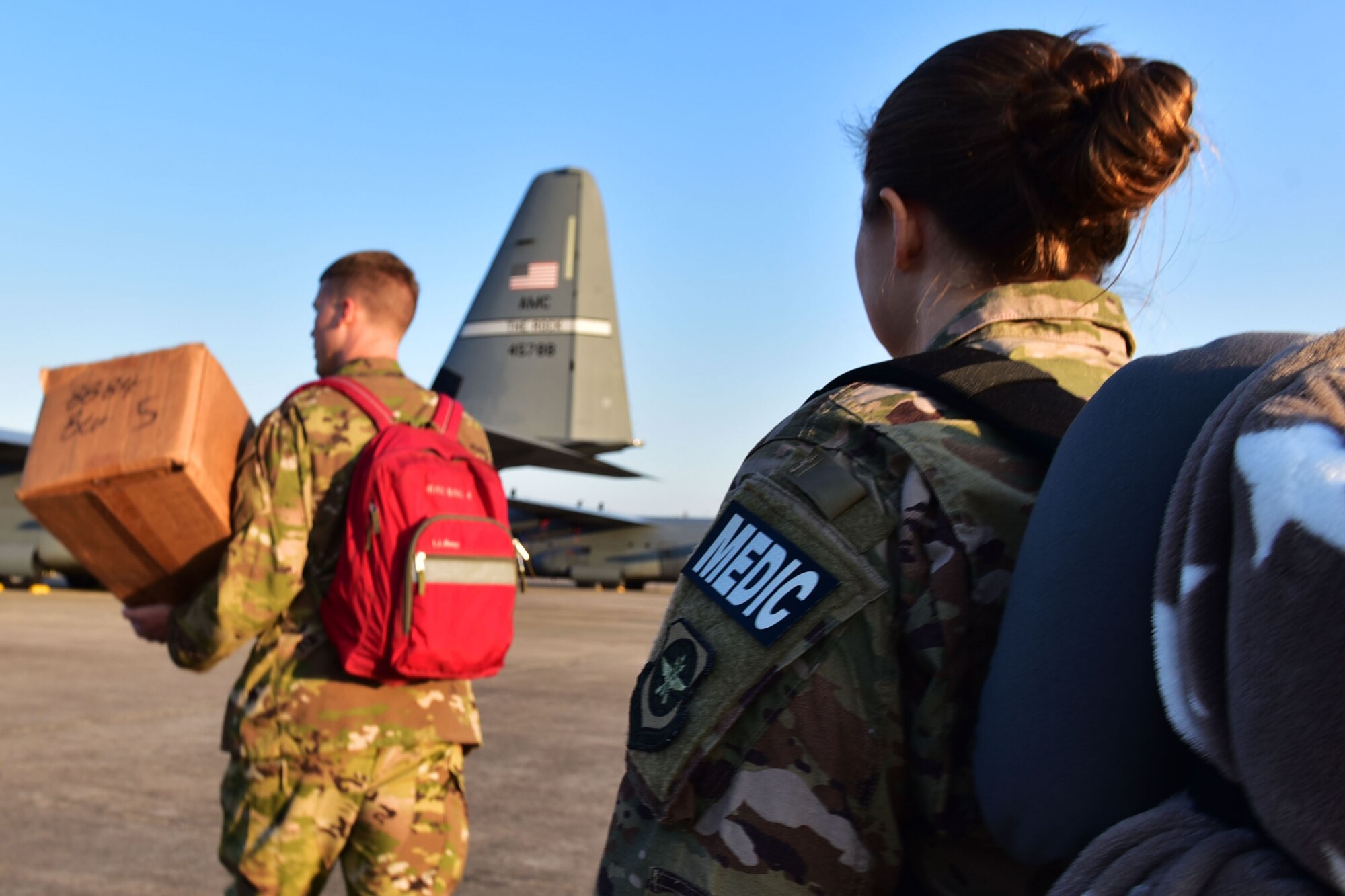 Tech. Sgt. Nicole Palko, 61st Airlift Squadron independent duty medical technician, boards a C-130J for deployment, at Little Rock Air Force Base, Ark. Palko will be providing medical support in the field for Team Little Rock members and others. (U.S. Air Force photo by Airman Rhett Isbell)