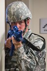 Staff Sgt. Jesse Johnson, 436th Security Forces Squadron response force leader, stands guard in the Mental Health clinic lobby during an active shooter exercise Sept. 12, 2017, at the Base Clinic, Dover Air Force Base, Del. Johnson made phone contact with the exercise active shooter who barricaded himself in the clinic, along with an undetermined number of hostages, wounded individuals, or casualties. (U.S. Air Force photo by Roland Balik)