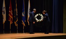 Col. Marcus Glenn, left, 341st Mission Support Group commander, and Staff Sgt. Kristan Hall, 341st Civil Engineer Squadron, place a wreath of flowers in honor and remembrance of the nation’s prisoners of war and those still missing in action in a ceremony Sept. 15, 2017, at Malmstrom Air Force Base, Mont. National Prisoner of War/Missing in Action Recognition Day is observed the third Friday in September to remember and honor those who were POWs, those still missing and their families. (U.S. Air Force photo/Airman First Class Daniel Brosam)