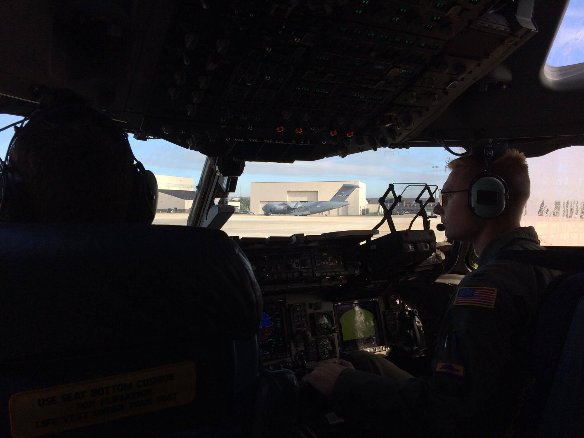 Capt. Evan Allen, 6th Airlift Squadron, prepares to take off with his C-17 crew from Joint Base McGuire-Dix-Lakehurst, N.J., Oct. 6, 2016 in response to Hurricane Matthew. The crew delivered the Joint Task Force-Port Opening team that establish the aerial port in Haiti allowing for 600,000 lbs. of relief supplies. The AMC aircrew was recognized with the 2016 Berlin Airlift Veterans Association Award Sept. 18, 2017 at the Air Force Association Convention in National Harbor, Md. (U.S. Air Force photo by Capt. Gary Rogers)