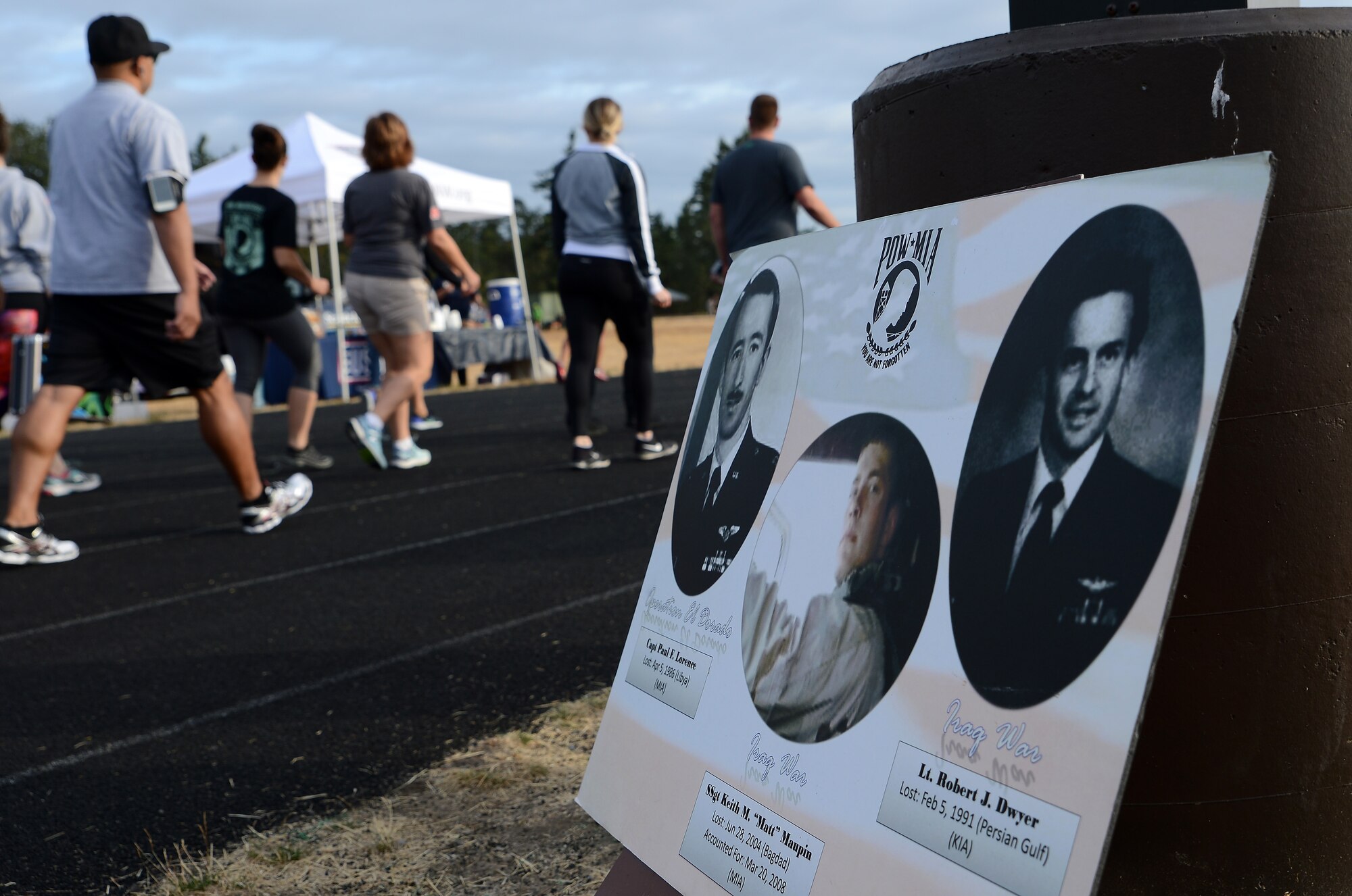 Team McChord Airmen participate in the 24-hour POW/MIA Memorial run, as part of the 2017 POW/MIA Remembrance Week, at the McChord Field track, Sept. 13, 2017, at Joint Base Lewis-McChord, Wash.