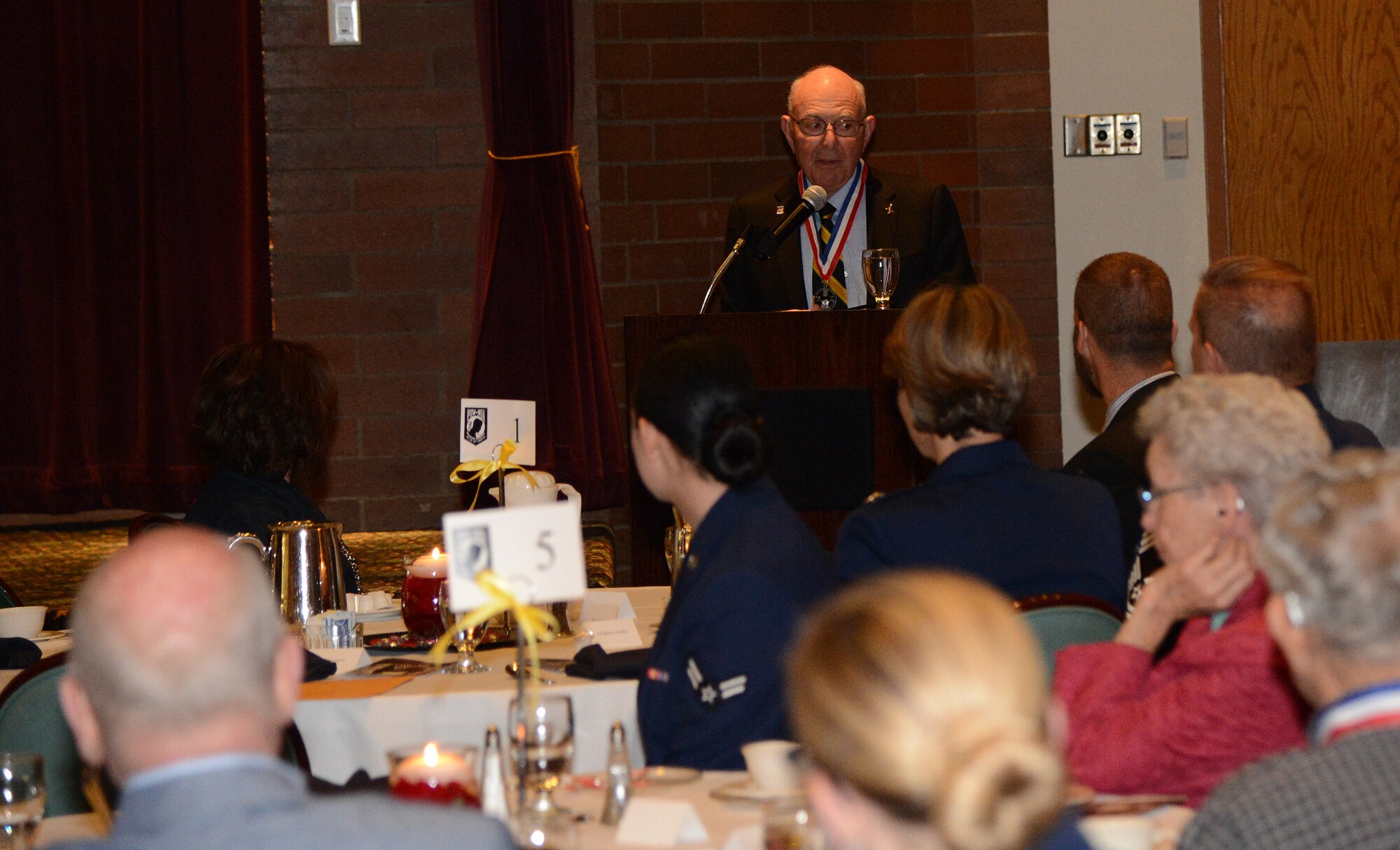 Retired Maj. Joseph Crecca, former prisoner of war and guest speaker, tells his POW story to attendees of the POW/MIA Remeberance Day Luncheon Sept. 15, 2017, at Joint Base Lewis-McChord, Wash.