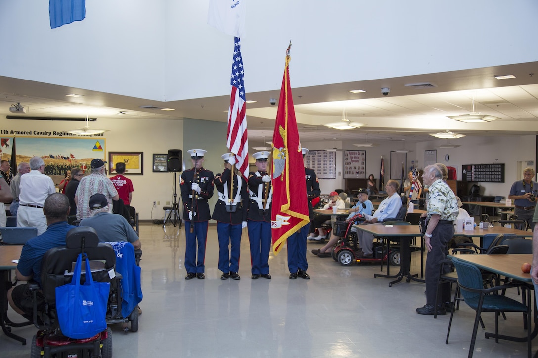 The Walking Color Guard from Marine Corps Logistics Base Barstow, Calif., presents the colors during the Pledge of Allegiance led by Teresa Rochester, Public Information Officer, Veterans Home of California Barstow, during the POW/MIA Recognition Ceremony, Sept. 15.