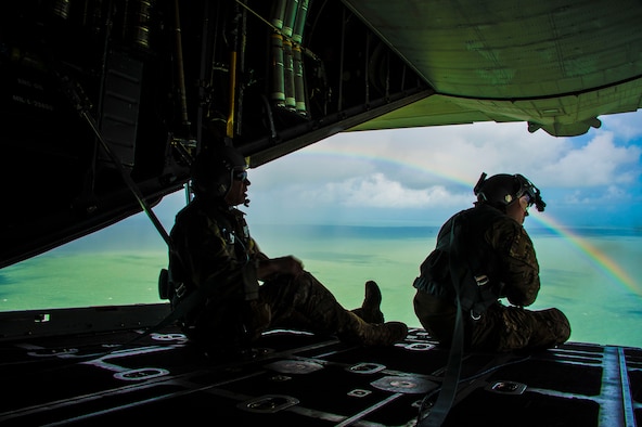 California Air National guardsman, Master Sgt. Eric Valdez,  MC-130P Combat Shadow aircraft loadmaster, looks out across the clear water of Florida's Key region during a reconnaissance and refueling mission supporting search and rescue efforts following hurricane Irma, September 11, 2017.  (U.S. Air National Guard photo by Tech. Sgt. Joseph Prouse/released)