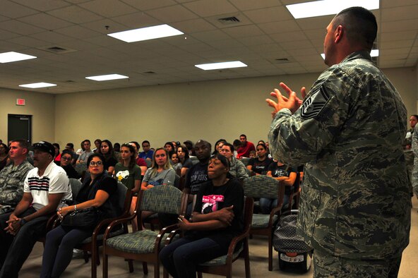 U.S. Air Force Senior Master Sgt. Anthony Wolfe, 20th Security Forces Squadron operations superintendent, speaks to Team Shaw members during a base housing resident town hall at Shaw Air Force Base, S.C., Sept. 7, 2017. Wolfe spoke about increased patrols in the housing area, precautions families can take to deter criminals and the proper reporting of incidents on base. (U.S. Air Force photo by Airman 1st Class Kathryn R.C. Reaves)