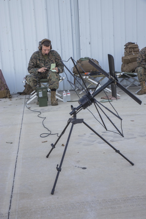 Lance Cpl. Kristofer Ayers, a radio operator with 14th Marine Regiment, 4th Marine Division, Marine Forces Reserve, operates a radio at a forward arming and refueling point set up by Marine Wing Support Squadron 473, 4th Marine Aircraft Wing, MARFORRES, on a runway at The Florida Keys Marathon International Airport, at Marathon, Fla. Sept. 14, 2017. Marines with MWSS-473 established a forward arming and refueling point to provide support to federal, state and local agencies, to assist in their search and rescue operations in wake of Hurricane Irma. (U.S. Marine Corps photo by Lance Cpl. Niles Lee/Released)