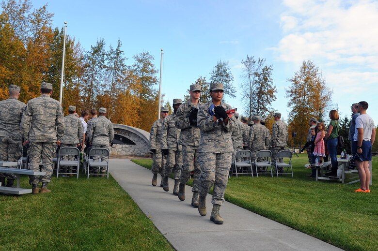 U.S. Air Force Airmen with the 354th Fighter Wing Honor Guard carry the American Flag after retreat Sept. 15, 2017, at Eielson Air Force Base, Alaska. The first POW/MIA Recognition Day was in 1979. (U.S. Air Force photo by Airman 1st Class Eric M. Fisher)