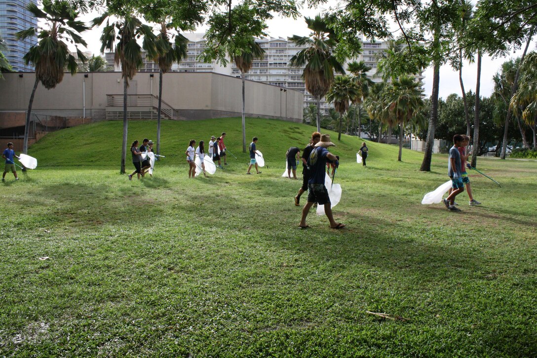 More than 80 volunteers scoured Fort DeRussy park and beach berm Sept. 9, picking up trash and clearing debris as part of this year's National Public Lands Day celebrations.