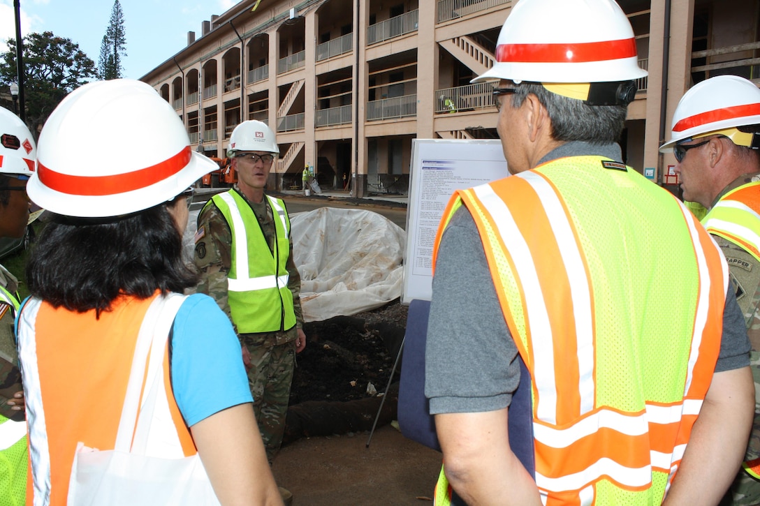 USACE Command Sergeant Major Bradley Houston talks with Quad D project engineers during a project briefing Sept. 13 at Schofield Barracks.