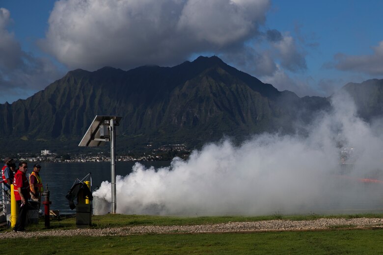 Exercise Lethal Breeze controllers simulate the burning of oil during the Anti-Terrorism/Force Protection Exercise Lethal Breeze, aboard Marine Corps Base Hawaii, (MCBH) Sept. 12, 2017. The exercise combined multiple agencies, on and off the installation, to respond to a simulated attack, mass casualty scenario, and an environmental oil spill. Exercise Lethal Breeze provided hands-on experience and training to prepare MCBH to protect personnel, facilities, and other assets from all threats and hazards. (U.S. Marine Corps Photo by Sgt. Alex Kouns)