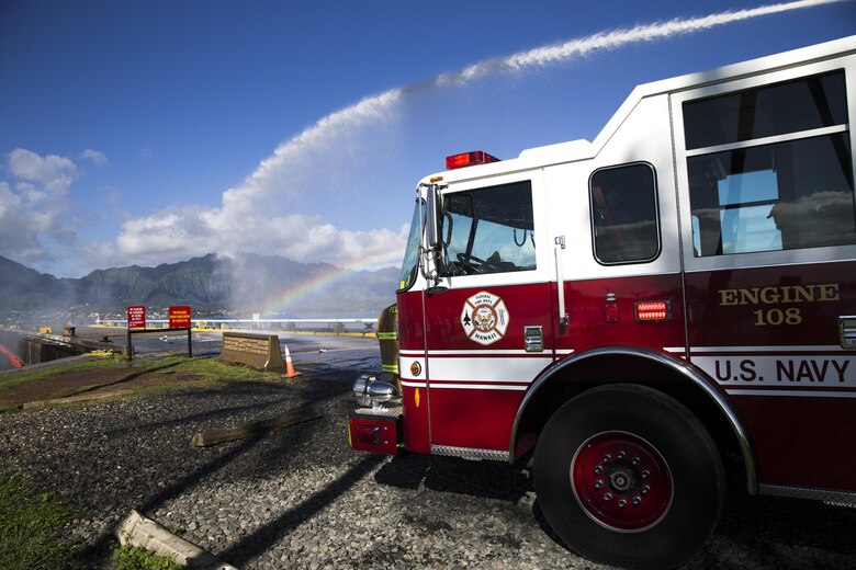 Personnel with the Marine Corps Base Hawaii (MCBH) Fire Department douse mock flames during the Anti-Terrorism/Force Protection Exercise Lethal Breeze, aboard MCBH, Sept. 12, 2017. The exercise combined multiple agencies, on and off the installation, to respond to a simulated attack, mass casualty scenario, and an environmental oil spill. Exercise Lethal Breeze provided hands-on experience and training to prepare MCBH to protect personnel, facilities, and other assets from all threats and hazards. (U.S. Marine Corps Photo by Sgt. Alex Kouns)