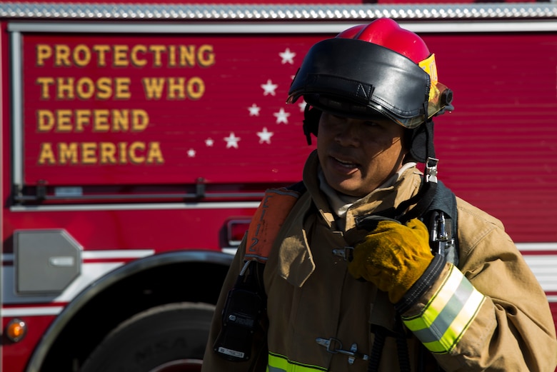 Lt. Ron Wong, fire fighter, Marine Corps Base Hawaii (MCBH) Fire Department participates in the Anti-Terrorism/Force Protection Exercise Lethal Breeze, aboard MCBH, Sept. 12, 2017. The exercise combined multiple agencies, on and off the installation, to respond to a simulated attack, mass casualty scenario, and an environmental oil spill. Exercise Lethal Breeze provided hands-on experience and training to prepare MCBH to protect personnel, facilities, and other assets from all threats and hazards. (U.S. Marine Corps Photo by Sgt. Alex Kouns)