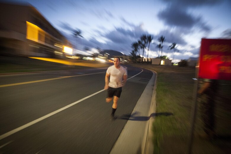 Seaman Anthony Ruiz, a craft master with Arizona Detachment, Joint Base Pearl Harbor-Hickam, finishes a 3-mile-lon run during a physical fitness test (PFT) part of the Reconnaissance screener aboard Marine Corps Base Hawaii (MCBH) on Sept. 8, 2017. Screeners with 3rd Reconnaissance Battalion evaluated service members interested in attending the Basic Reconnaissance Course with a PFT, aquatic exercises at the base pool, followed by the maneuver under fire portion of the combat fitness test twice, ending with a 6-mile-long pack run. (U.S. Marine Corps photo by Cpl. Jesus Sepulveda Torres)