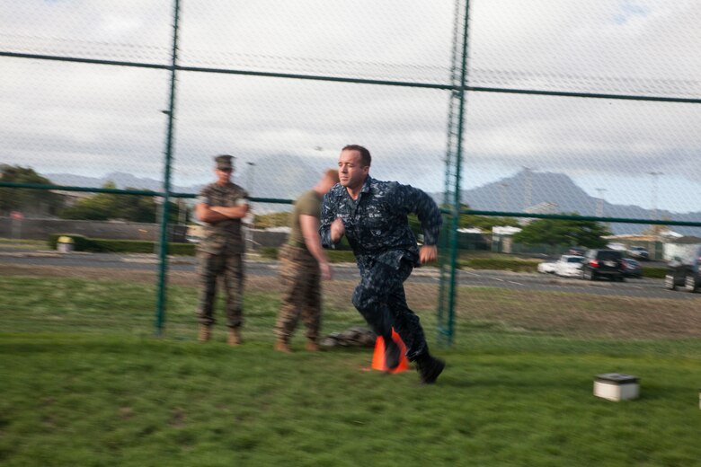 Seaman Anthony Ruiz, a craft master with Arizona Detachment, Joint Base Pearl Harbor-Hickam, begins the maneuver under fire portion of the combat fitness test (CFT) during the reconnaissance screener aboard Marine Corps Base Hawaii (MCBH) on Sept. 8, 2017. Screeners with 3rd Reconnaissance Battalion evaluated service members interested in attending the Basic Reconnaissance Course with a physical fitness test, aquatic exercises at the base pool, followed by the maneuver under fire portion of the CFT twice, ending with a 6-mile-long pack run. (U.S. Marine Corps photo by Cpl. Jesus Sepulveda Torres)