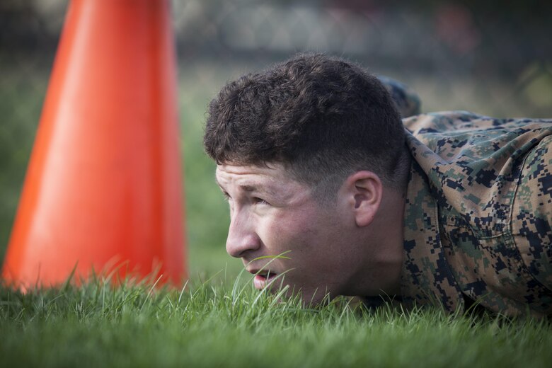 Lance Cpl. Robert Cortez, a rifleman with 2nd Battalion, 3rd Marine Regiment, gets in the starting position prior to conducting a combat fitness test (CFT) part of the Reconnaissance screener aboard Marine Corps Base Hawaii (MCBH) on Sept. 8, 2017. Screeners with 3rd Reconnaissance Battalion evaluated service members interested in attending the Basic Reconnaissance Course with a physical fitness test, aquatic exercises at the base pool, followed by the maneuver under fire portion of the CFT twice, ending with a 6-mile-long pack run. (U.S. Marine Corps photo by Cpl. Jesus Sepulveda Torres)