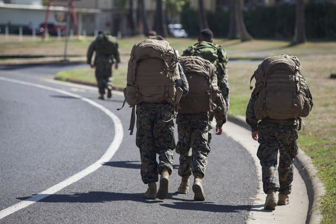 U.S. Marines with Marine Corps Base Hawaii (MCBH) begin a hike part of the reconnaissance screener aboard MCBH on Sept. 8, 2017. Screeners with 3rd Reconnaissance Battalion evaluated service members interested in attending the Basic Reconnaissance Course with a physical fitness test, aquatic exercises at the base pool, followed by the maneuver under fire portion of the combat fitness test twice, ending with a 6-mile-long pack run. (U.S. Marine Corps photo by Cpl. Jesus Sepulveda Torres)