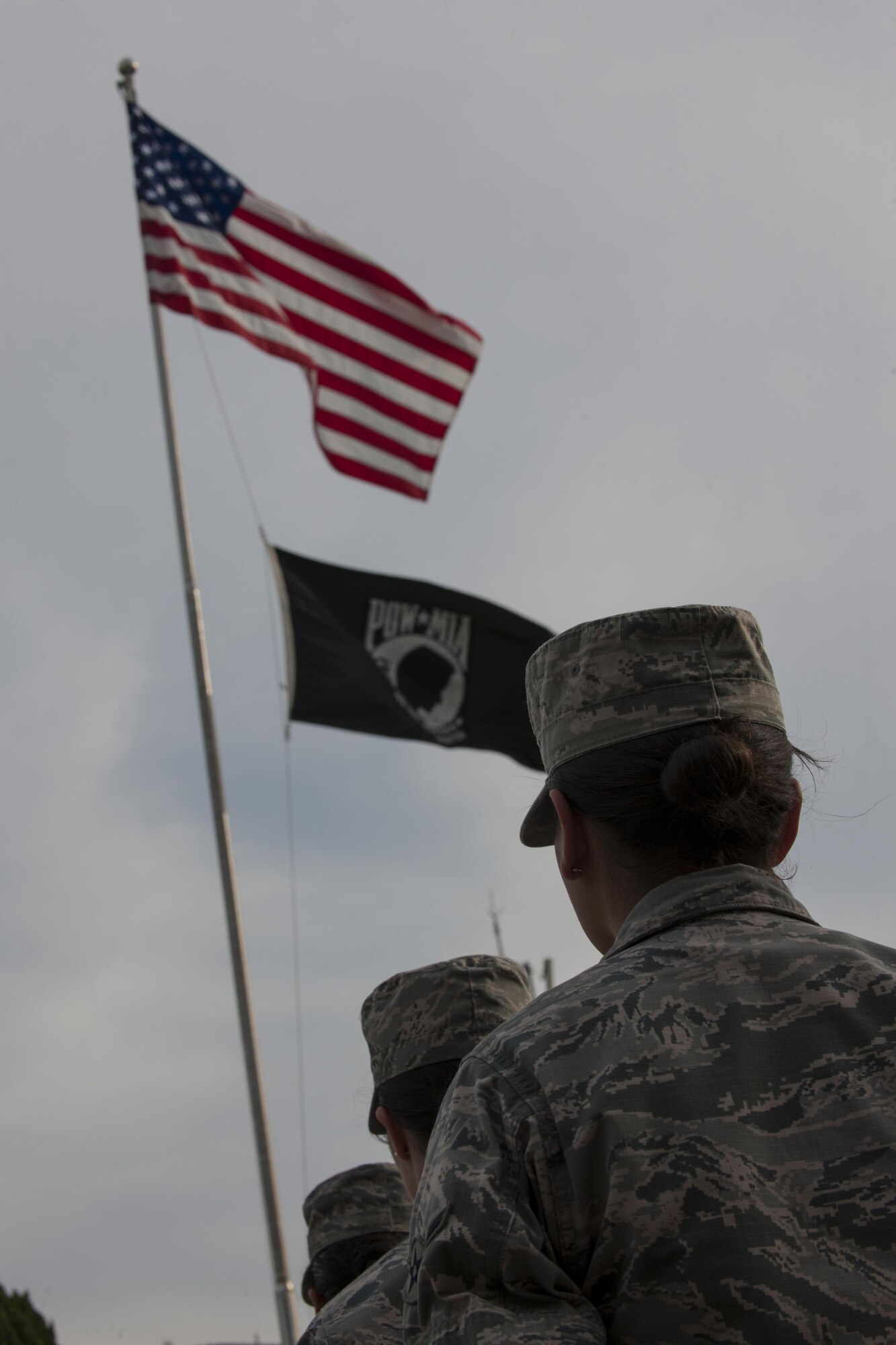 U.S. Air Force Airmen stand at parade rest during the closing ceremony of the POW/MIA Recognition Day at Kunsan Air Base, Republic of Korea, Sept. 15, 2017. In the U.S., the day is observed annually on the third Friday in September to honor those who were prisoners of war and those who are still missing in action. (U.S. Air Force photo by Staff Sgt. Victoria H. Taylor)