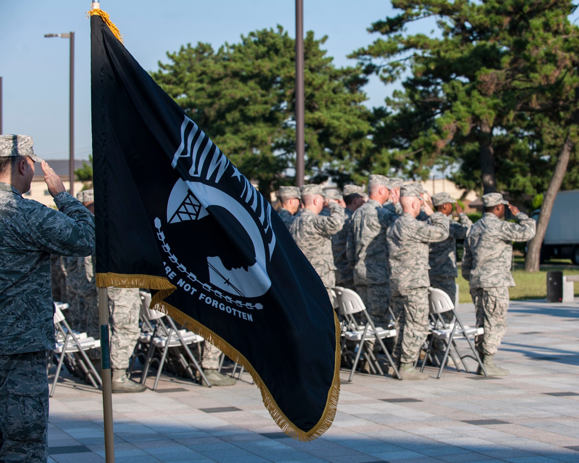 U.S. Air Force Airmen render a salute during the opening ceremony of Prisoner of War and Missing in Action Recognition Day at Kunsan Air Base, Republic of Korea, Sept. 14, 2017. In the U.S., this day is observed annually on the third Friday in September to honor those who were prisoners of war and those who are still missing in action. According to the Defense POW/MIA Accounting Agency, there are still 82,467 Americans still missing from past conflicts dating back to World War II. (U.S. Air Force photo by Staff Sgt. Victoria H. Taylor)