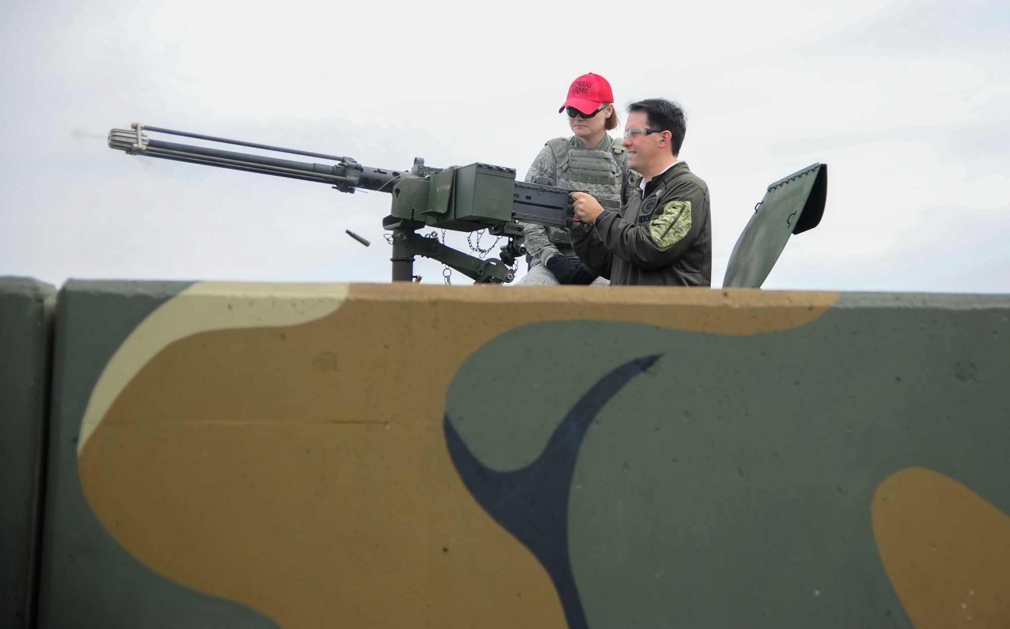 The Honorable Scott Walker, Governor of Wisconsin, fires blanks rounds from a .50 caliber machine gun mounted on a HMMWV during an 8th Security Forces Squadron demonstration at Kunsan Air Base, Republic of Korea, Sept. 16, 2017. Walker visited Wisconsin Air National Guard 115th Fighter Wing Airmen deployed as part of a Theater Security Package and gained a greater understanding of the Wolf Pack’s mission. (U.S. Air Force photo by Senior Airman Colby L. Hardin)