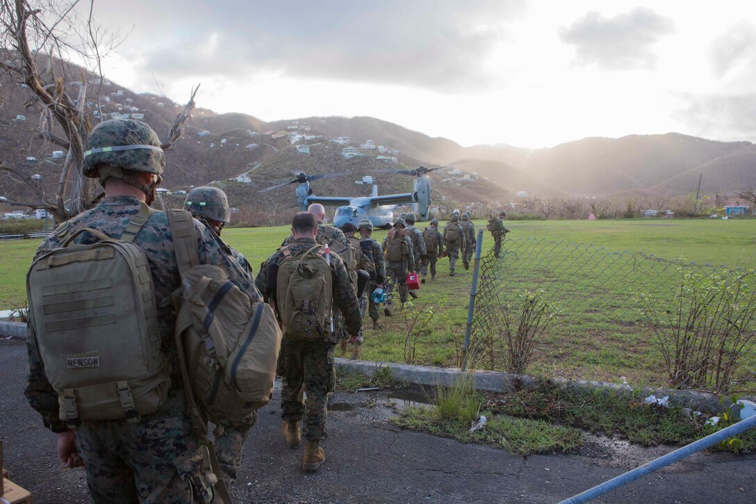 U.S. Marine Corps Sgt. Austin C. Morgan, an assaultman with Battalion Landing Team 2nd Battalion, 6th Marine Regiment, 26th Marine Expeditionary Unit (MEU), to clear debris at a local fire station that was affected by Hurricane Irma in St. John, U.S. Virgin Islands, Sept. 17, 2017.