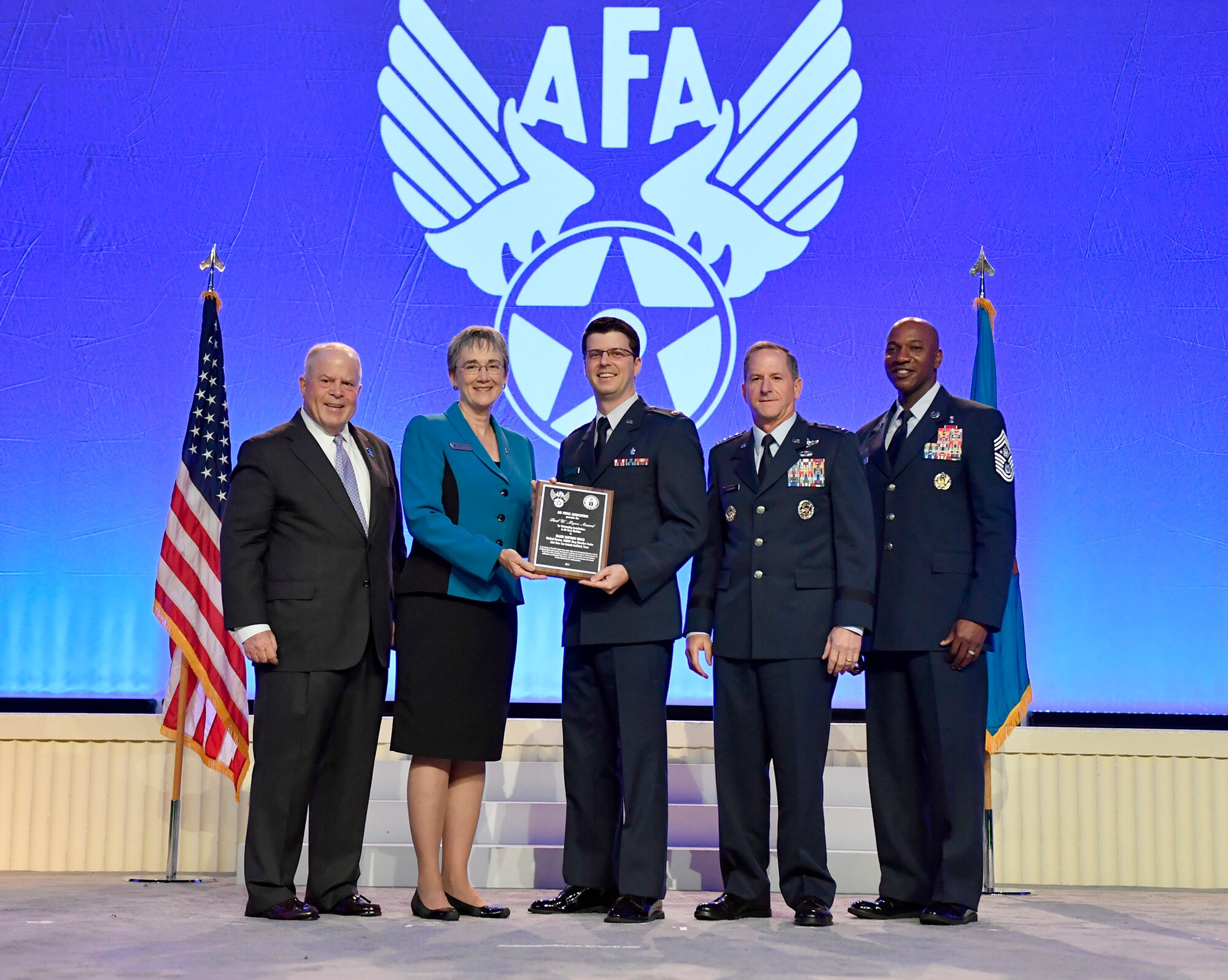 Maj. Matthew Brock, 59th Medical Wing, Joint Base San Antonio-Lackland, Texas, receives the Paul W. Meyers award at the Air Force Association's Air, Space and Cyber Conference in National Harbor, Md., Sept. 18, 2017. Chairman of the Board F. Whitten Peters, Secretary of the Air Force Heather Wilson, Air Force Chief of Staff Gen. David Goldfein and Chief Master Sgt. of the Air Force Kaleth Wright presented the awards. (U.S. Air Force photo by Wayne Clark)