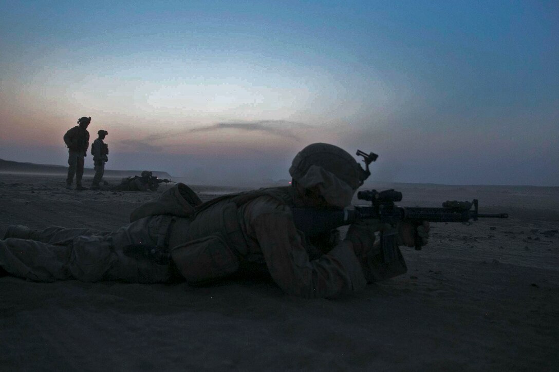 A Marine fires his weapon while participating in fire support coordination training.