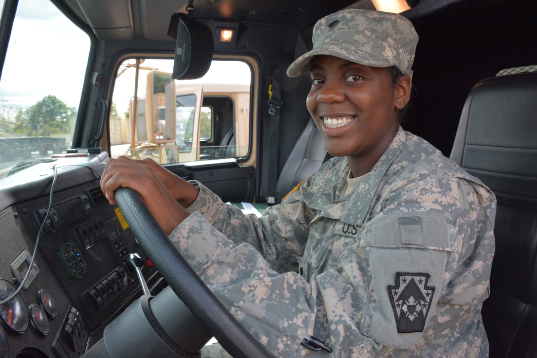 Army Spc. Breyonnha Chester, a motor transport operator with the Pennsylvania Army National Guard's Detachment 1, 1067th Transportation Company, 213th Regional Support Group, sits ready at the wheel of her M915 truck, which she drove from Pennsylvania to Texas and back to provide relief supplies and equipment to those affected by Hurricane Harvey, Sept. 10, 2017. Army National Guard photo by Sgt. Shane Smith