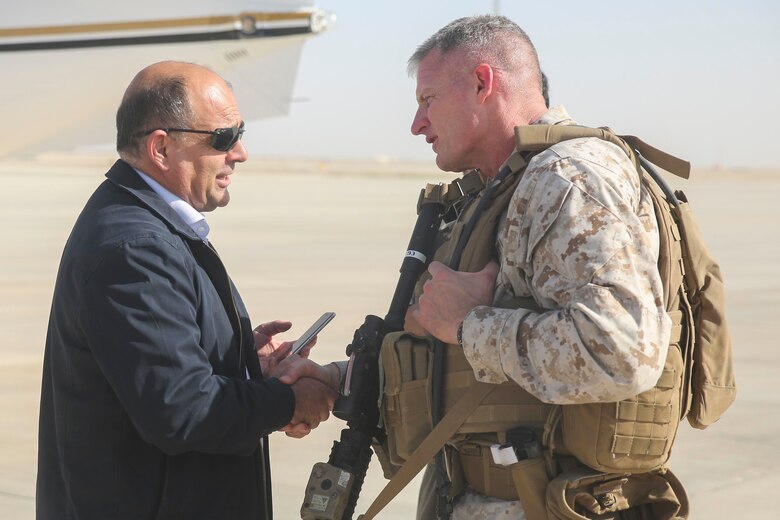 Brig. Gen. Roger Turner, the commanding general for Task Force Southwest, greets Wais Ahmad Barmak, the Minister of Interior for Afghanistan, at Bastian Airfield, Afghanistan, Sept. 11, 2017. The purpose of the visit for the Afghan Minister of Interior was an introduction to the leadership of 505th Zone National Police and an opportunity to meet some of the MOI forces at Bost Airfield. (U.S. Marine Corps photo by Sgt. Lucas Hopkins)