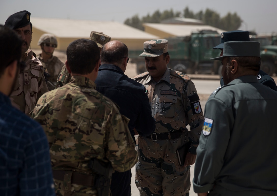 Wais Ahmad Barmak, the Minister of Interior for Afghanistan, greets Afghan National Defense and Security Force key leaders at Bost Airfield, Afghanistan, Sept. 11, 2017. The key leaders came together to discuss a better way to streamline processes for supply, promotions, training opportunities, the distribution of vehicles and weapons, as well as what can be done to counter the corruption that is present in Helmand Province. (U.S. Marine Corps photo by Sgt. Justin T. Updegraff)