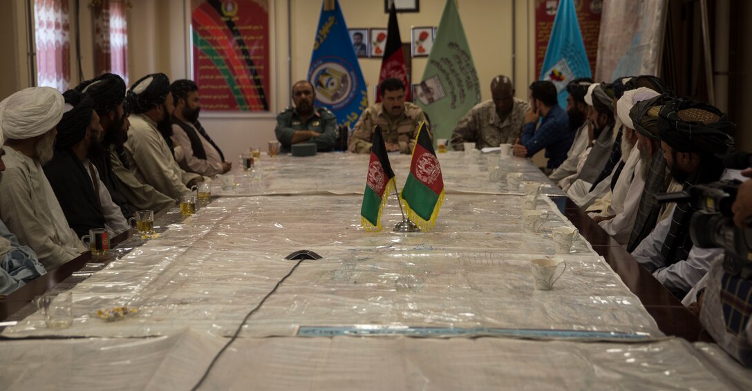 Brig. Gen. Daud Ghulam Tarakhel, the commanding general of the 505th Zone National Police, listens to statements and accusations during a shura with tribal elders from Helmand Province at Bost Airfield, Afghanistan, Sept. 13, 2017. Brig. Gen. Tarakhel held the shura to collect statements of alleged corruption issues within a district in Helmand, and passed the statements to a counter-corruption team at the Police Provincial Headquarters in Lashkar Gah for further investigation. (U.S. Marine Corps photo by Sgt. Justin T. Updegraff)