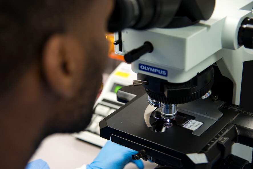 Staff Sgt. Cory Gage, 23d Medical Support Squadron medical laboratory technician, looks through a microscope for cell abnormalities, Aug. 18, 2017, at Moody Air Force Base, Ga. Moody’s lab technicians process blood to check for a variety of variances from infections to cancer.  (U.S. Air Force photo by Airman 1st Class Erick Requadt)