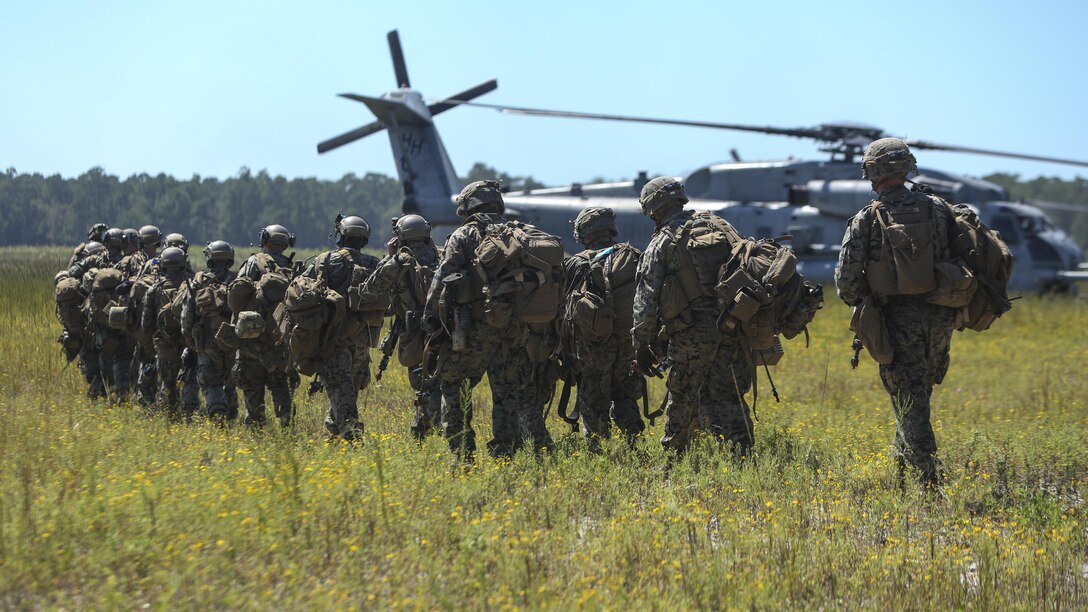 Marines make their way to a CH-53E Super Stallion helicopter during aerial insert drills at Camp Lejeune, N.C., Sep. 13, 2017. The exercise is part of a Marine Corps Combat Readiness Evaluation to test the unit’s capabilities in a combat environment. The Marines are with 1st Battalion, 6th Marine Regiment. (U.S. Marine Corps photo by Lance Cpl. Holly Pernell)