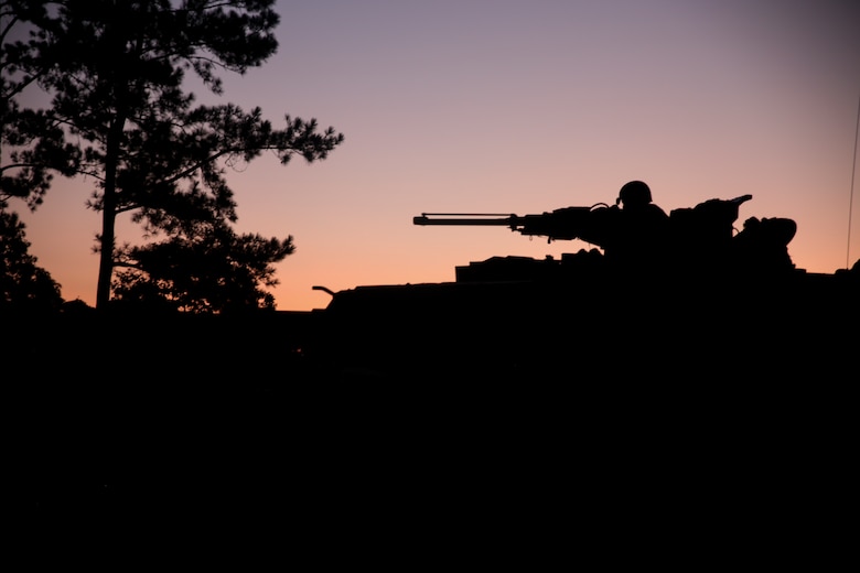 A Marine scans for enemy movement from an M1A1 Abrams tank in support of the 1st Battalion, 6th Marine Regiment Marine Corps Combat Readiness Evaluation at Camp Lejeune, N.C., Sep. 15, 2017. The MCCRE is testing the unit’s capabilities in a combat environment. The Marine is with 2nd Tank Battalion. (U.S. Marine Corps photo by Lance Cpl. Holly Pernell)