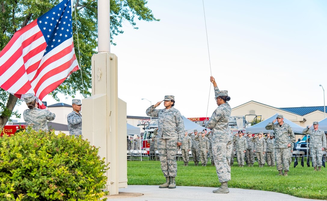 Members of the Dover Air Force Base Honor Guard lower the U.S. flag during the National Prisoner of War and Missing in Action Recognition Day ceremony Sept. 15, 2017, on Dover Air Force Base, Del. The names of 178 fallen service members from previous wars and conflicts that have been repatriated this past year were read by six members of the Armed Forces Medical Examiner System during the ceremony. (U.S. Air Force photo by Roland Balik)