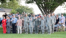Team Dover members and guests render a salute or place their hand over their heart while the base honor guard lowers the U.S. flag during the National Prisoner of War and Missing in Action Recognition Day ceremony Sept. 15, 2017, on Dover Air Force Base, Del. One hundred seventy-eight fallen service members from previous wars and conflicts were repatriated this past year. (U.S. Air Force photo by Roland Balik)