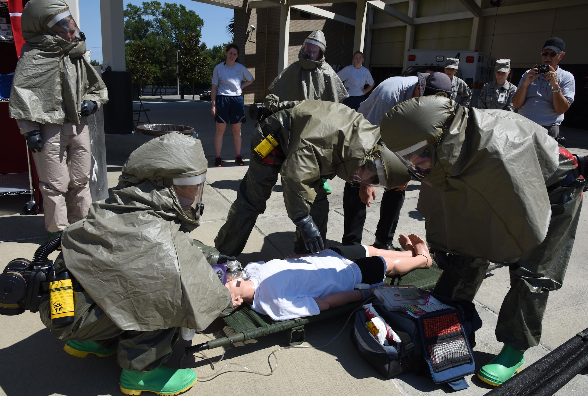 Members of the 81st Medical Group administer triage to a “patient” during the 81st MDG integrated in-place patient decontamination training course behind the Keesler Medical Center Sept. 14, 2017, on Keesler Air Force Base, Mississippi. The two-day course trained 21 personnel, which came from four different disaster medical teams: IPPD, triage, manpower and security. Throughout the training, they learned to utilize Keesler’s fixed decontamination facility and how to set up and tear down the decontamination tent. (U.S. Air Force photo by Kemberly Groue)