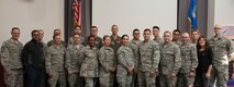 Chief Master Sgt. Bryan A. Payne, 349th Air Mobility Wing command chief (far left) poses for a photo with the wing’s newest members at Travis Air Force Base, Calif., September 9, 2017.